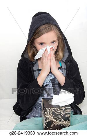 girl in a black hood, blowing her nose and sneezing View Large Photo Image Stock Image - girl in a black hood, blowing her nose and sneezing. Fotosearch