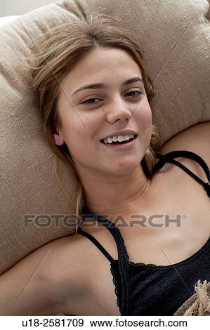 Stock Photo - girl in bed with bikini. Fotosearch
