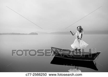 girl in boat, flowers, water View Large Photo Image Stock Image - girl in boat, flowers, water. Fotosearch