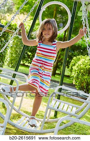 Stock Image - Girl playing in the park. Getaria. Gipuzkoa. Basque Country. Spain. Fotosearch