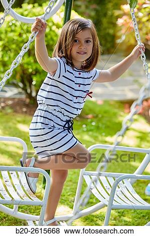 Girl playing in the park. Getaria. Gipuzkoa. Basque Country. Spain View Large Photo Image Stock Photo - Girl playing in the park. Getaria. Gipuzkoa. Basque Country. Spain. Fotosearch