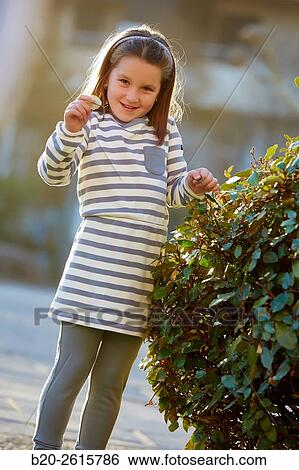 Girl playing in the park. Zumaia. Gipuzkoa. Basque Country. Spain View Large Photo Image Stock Photograph - Girl playing in the park. Zumaia. Gipuzkoa. Basque Country. Spain. Fotosearch