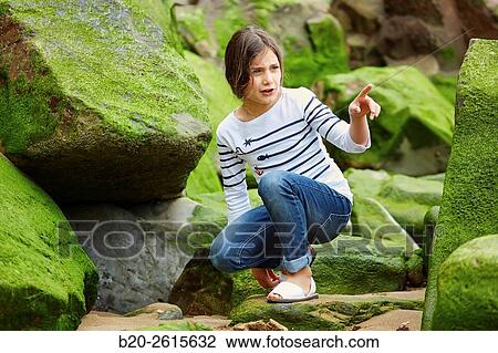 Girl playing on the rocks. Getaria. Gipuzkoa. Basque Country. Spain View Large Photo Image Stock Image - Girl playing on the rocks. Getaria. Gipuzkoa. Basque Country. Spain. Fotosearch