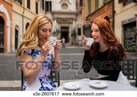 Girlfriends having coffee in Rome Italy View Large Photo Image Stock Photo - Girlfriends having coffee in Rome Italy. Fotosearch