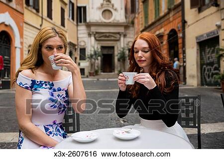 Girlfriends having coffee in Rome Italy View Large Photo Image Stock Photograph - Girlfriends having coffee in Rome Italy. Fotosearch