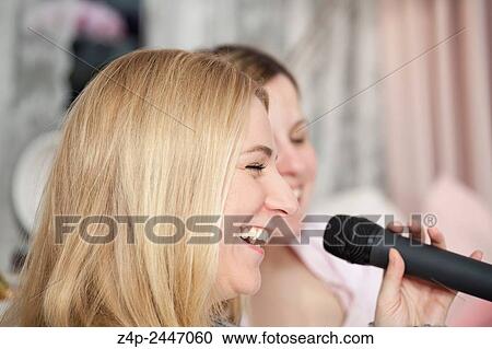 Girlfriends singing karaoke. View Large Photo Image Stock Image - Girlfriends singing karaoke.. Fotosearch