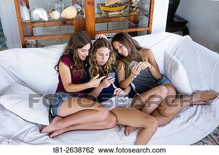 Girls looking at mobile chat, Valencia, Spain View Large Photo Image Stock Image - Girls looking at mobile chat, Valencia, Spain. Fotosearch