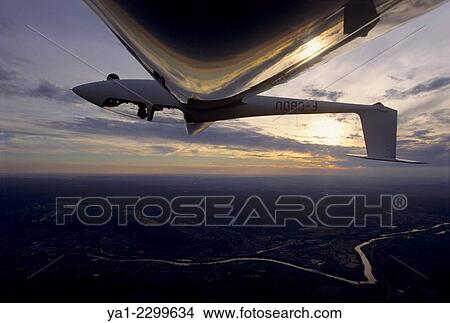 Glider plane in aerobatic flight over Nancy, Lorraine region, France. View Large Photo Image Picture - Glider plane in aerobatic flight over Nancy, Lorraine region, France.. Fotosearch
