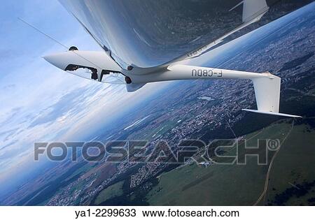Glider plane in aerobatic flight over Nancy, Lorraine region, France. View Large Photo Image Stock Image - Glider plane in aerobatic flight over Nancy, Lorraine region, France.. Fotosearch