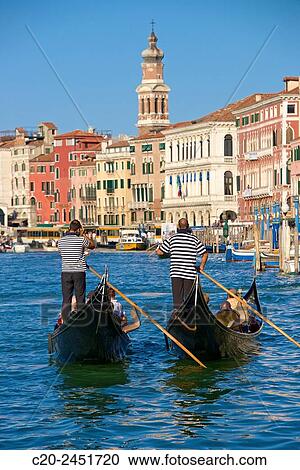 Gondolas and gondoliers, Palaces facades, church steeple, Canal Grande, Venice, Venetia, Italy. View Large Photo Image Stock Image - Gondolas and gondoliers, Palaces facades, church steeple, Canal Grande, Venice, Venetia, Italy.. Fotosearch