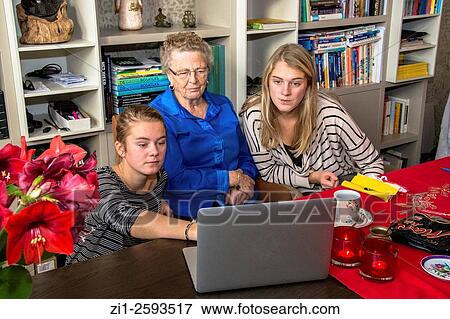 grandmother with two grandchildren in front of laptop View Large Photo Image Stock Photo - grandmother with two grandchildren in front of laptop. Fotosearch