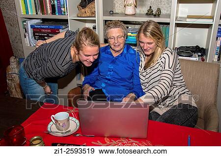 grandmother with two grandchildren haring fun in front of laptop View Large Photo Image Stock Photo - grandmother with two grandchildren haring fun in front of laptop. Fotosearch
