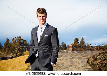 Stock Photo - Groom portrait in Central Oregon on his wedding day.. Fotosearch