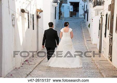 Grooms walking the streets of Altea on their wedding day, Altea, Alicante, Valencia, Spain, Europe View Large Photo Image Stock Photo - Grooms walking the streets of Altea on their wedding day, Altea, Alicante, Valencia, Spain, Europe. Fotosearch