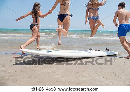 group of girls and boy running on the beach in Castellon. Spain View Large Photo Image Stock Photo - group of girls and boy running on the beach in Castellon. Spain. Fotosearch