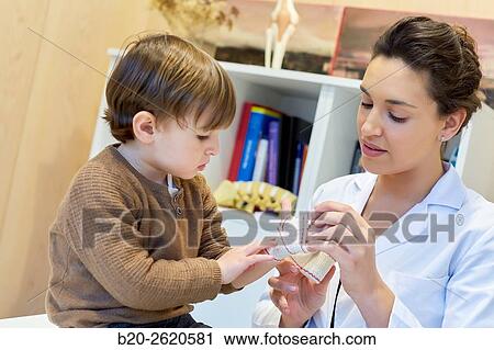 Hand child. Congenital hand. Doctor attending to patient medical consultation. Office. Plastic surgery. Pediatrician. View Large Photo Image Stock Image - Hand child. Congenital hand. Doctor attending to patient medical consultation. Office. Plastic surgery. Pediatrician.. Fotosearch