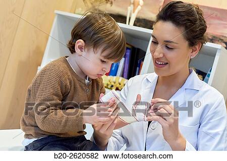 Hand child. Congenital hand. Doctor attending to patient medical consultation. Office. Plastic surgery. Pediatrician. View Large Photo Image Stock Image - Hand child. Congenital hand. Doctor attending to patient medical consultation. Office. Plastic surgery. Pediatrician.. Fotosearch