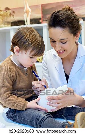 Hand child. Congenital hand. Doctor attending to patient medical consultation. Office. Plastic surgery. Pediatrician. View Large Photo Image Stock Image - Hand child. Congenital hand. Doctor attending to patient medical consultation. Office. Plastic surgery. Pediatrician.. Fotosearch