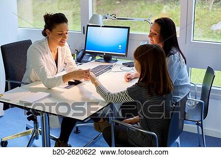 Stock Image - Hand child. Congenital hand. Doctor attending to patient medical consultation. Office. Plastic surgery.. Fotosearch