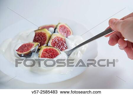 Hand having black figs with cream. Close view. View Large Photo Image Stock Image - Hand having black figs with cream. Close view.. Fotosearch