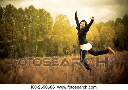 Stock Photograph - Happy girl in Navaluenga, Avila province, Spain.. Fotosearch