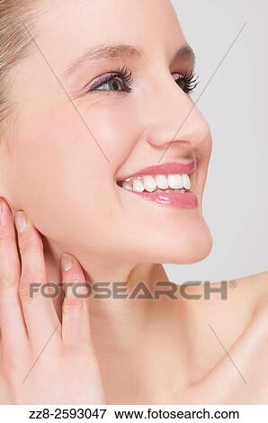 Happy woman smiling and looking away. View Large Photo Image Stock Photo - Happy woman smiling and looking away.. Fotosearch