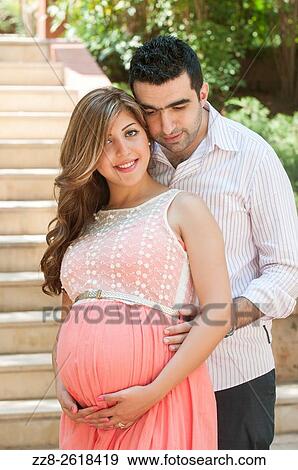 Husband with pregnant wife outdoors. View Large Photo Image Stock Photo - Husband with pregnant wife outdoors.. Fotosearch
