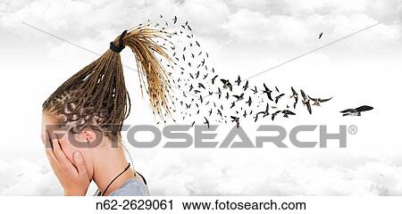 Stock Image - In a surreal sky, swallows come out from the braids of a girl who covers her face in front of many clouds.. Fotosearch