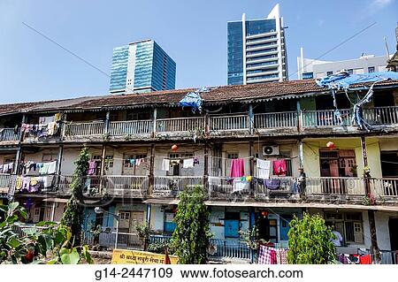 India, Asian, Mumbai, Lower Parel, old, older, apartment building, residences, balconies, hanging, laundry, clothes, new modern skyscrapers. View Large Photo Image Stock Photo - India, Asian, Mumbai, Lower Parel, old, older, apartment building, residences, balconies, hanging, laundry, clothes, new modern skyscrapers.. Fotosearch