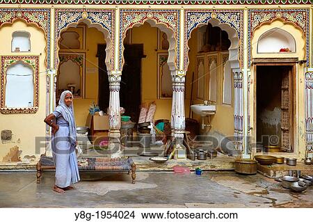 Indian woman in courtyard of historic haveli mansion, Mandawa Mandava, India. View Large Photo Image Picture - Indian woman in courtyard of historic haveli mansion, Mandawa Mandava, India.. Fotosearch