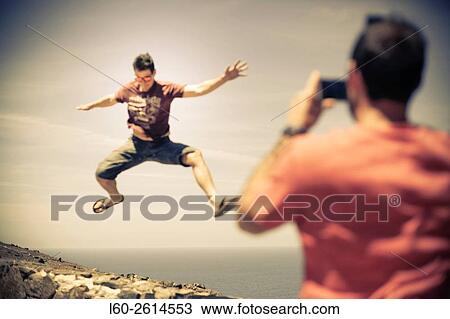 Stock Image - Jump, Cofete beach on the south west coast of Fuerteventura, Canary Islands, Spain.. Fotosearch