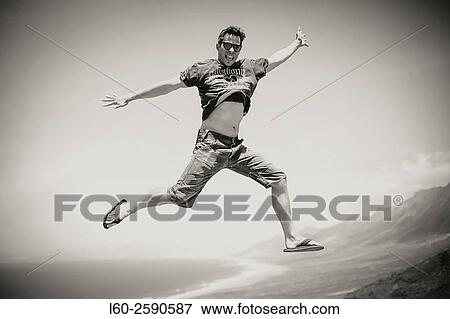 Jump, Cofete beach on the south west coast of Fuerteventura, Canary Islands, Spain. View Large Photo Image Stock Photo - Jump, Cofete beach on the south west coast of Fuerteventura, Canary Islands, Spain.. Fotosearch