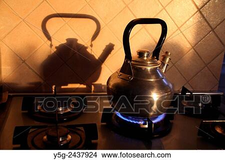 kettle on gas stove in kitchen View Large Photo Image Picture - kettle on gas stove in kitchen. Fotosearch