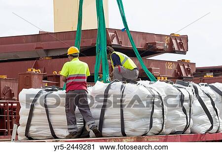 Stock Image - Las Palmas, Gran Canaria, Canary Islands, Spain. 4, 500 tonnes of rice from United Nations World Food Programme`s logistics hub in Las Palmas port being loaded onto ship in Las Palmas port.. Fotosearch