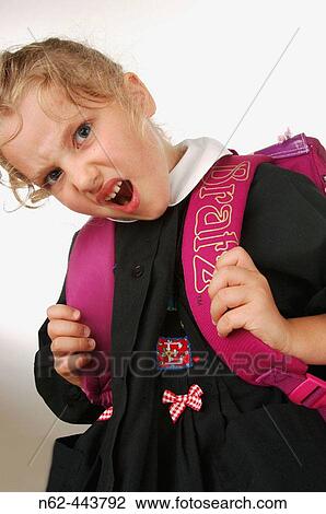 Little girl elementary school mischievous bottom view holds hands the straps of her backpack View Large Photo Image Stock Image - Little girl elementary school mischievous bottom view holds hands the straps of her backpack. Fotosearch