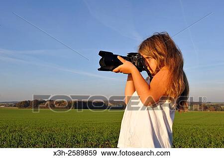 little girl shooting in the countryside, France, Europe View Large Photo Image Stock Photo - little girl shooting in the countryside, France, Europe. Fotosearch