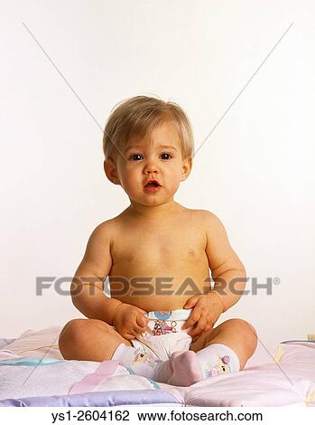 Little Girl sitting against White Background. View Large Photo Image Stock Image - Little Girl sitting against White Background.. Fotosearch