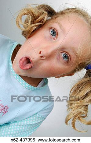 Little girl with pigtails bottom view makes some funny faces View Large Photo Image Stock Photography - Little girl with pigtails bottom view makes some funny faces. Fotosearch