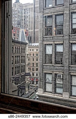 Looking out the window of a Flat Iron building at the Flatiron District of New York City, on a Rainy Day. View Large Photo Image Stock Photo - Looking out the window of a Flat Iron building at the Flatiron District of New York City, on a Rainy Day.. Fotosearch