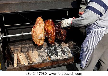 Man cooking Prague ham and other meat on a rotisserie in Old Town Square, Prague, Czech Republic, historical center listed as World Heritage by UNESCO, the old town (Stare Mesto), Old town Square (Staromestske namesti), Europe. View Large Photo Image Stock Image - Man cooking Prague ham and other meat on a rotisserie in Old Town Square, Prague, Czech Republic, historical center listed as World Heritage by UNESCO, the old town (Stare Mesto), Old town Square (Staromestske namesti), Europe.. Fotosearch