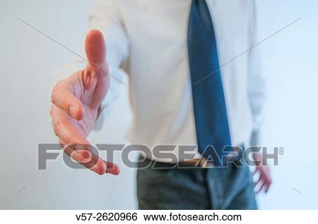 Man extending his open hand, offering handshake. View Large Photo Image Stock Photograph - Man extending his open hand, offering handshake.. Fotosearch