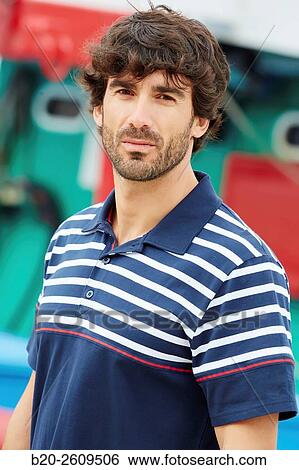 Stock Photograph - Man in the fishing port. Getaria. Gipuzkoa. Basque Country. Spain. Fotosearch