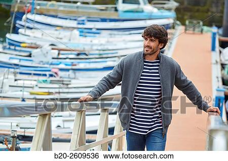 Man in the marina. Port. Getaria. Gipuzkoa. Basque Country. Spain View Large Photo Image Stock Photograph - Man in the marina. Port. Getaria. Gipuzkoa. Basque Country. Spain. Fotosearch