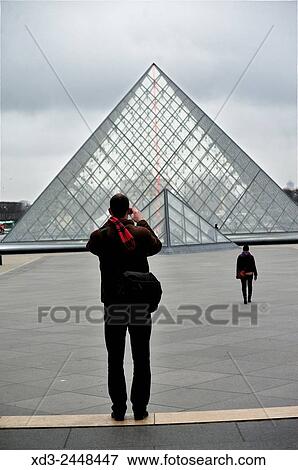 man taking picture of La Pyramide de Louvre, Louvre Museum, Paris, France. View Large Photo Image Stock Photo - man taking picture of La Pyramide de Louvre, Louvre Museum, Paris, France.. Fotosearch