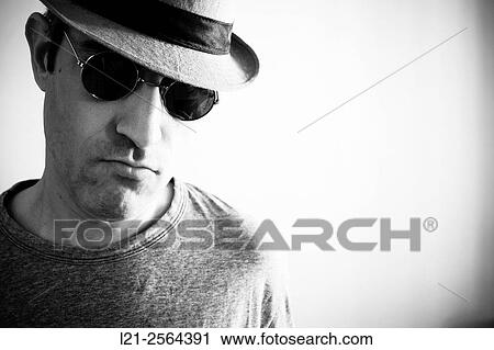 Man with sunglasses and hat. View Large Photo Image Stock Image - Man with sunglasses and hat.. Fotosearch