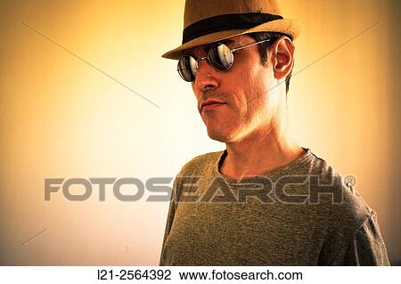 Man with sunglasses and hat. View Large Photo Image Stock Image - Man with sunglasses and hat.. Fotosearch