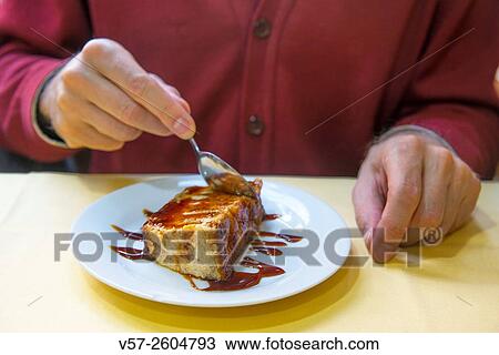 Man's hand having a pudding. Close view. View Large Photo Image Stock Image - Man's hand having a pudding. Close view.. Fotosearch