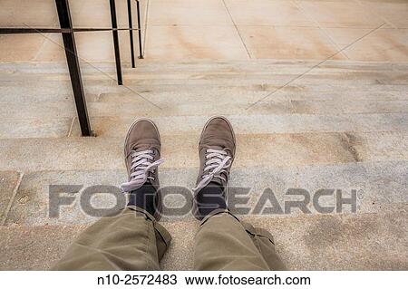 Man's legs and feet on the steps of a concrete building. View Large Photo Image Stock Image - Man's legs and feet on the steps of a concrete building.. Fotosearch