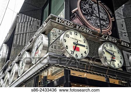 Marquee at the Tourneau Store on East 57th Street and Madison Avenue, lined with clocks showing the time in many cities all over the world. A Landmark display. View Large Photo Image Stock Photograph - Marquee at the Tourneau Store on East 57th Street and Madison Avenue, lined with clocks showing the time in many cities all over the world. A Landmark display.. Fotosearch