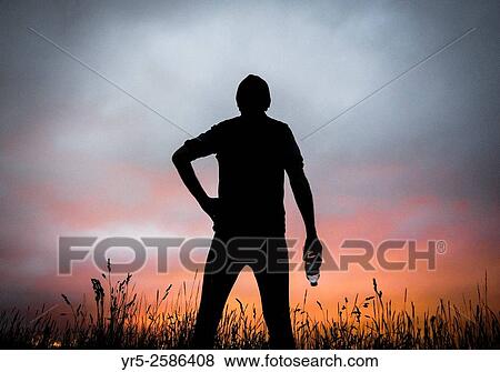 Mature male runner stops to watch the sun rise. Cowpen Woodland Park, Billingham, England, United Kingdom. View Large Photo Image Stock Photo - Mature male runner stops to watch the sun rise. Cowpen Woodland Park, Billingham, England, United Kingdom.. Fotosearch